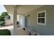 Charming entrance featuring a blue door, sidelight window, and a cozy porch area at 400 Silver Spring St, Dallas, GA 30157