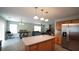 Open-concept kitchen with an island flowing into the dining and living areas at 400 Silver Spring St, Dallas, GA 30157