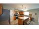 Well-lit kitchen featuring wood cabinets, stainless steel appliances, and a central island at 400 Silver Spring St, Dallas, GA 30157