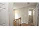Bright landing area featuring wood floors, natural light, and access to multiple rooms and stairway at 400 Silver Spring St, Dallas, GA 30157
