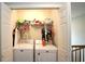 Convenient laundry closet with washer, dryer, and upper storage shelf; ideal for easy laundry access at 400 Silver Spring St, Dallas, GA 30157