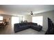 Cozy living room with tile floors, ceiling fan, and open layout to kitchen at 400 Silver Spring St, Dallas, GA 30157
