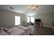 Spacious bedroom featuring high ceilings, ceiling fan, and dark wood flooring at 400 Silver Spring St, Dallas, GA 30157