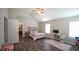 Spacious bedroom featuring high ceilings, ceiling fan, and dark wood flooring at 400 Silver Spring St, Dallas, GA 30157