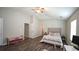 Spacious bedroom featuring high ceilings, ceiling fan, and dark wood flooring at 400 Silver Spring St, Dallas, GA 30157