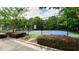 Community tennis court surrounded by lush greenery and well-maintained landscaping for active lifestyles at 400 Silver Spring St, Dallas, GA 30157