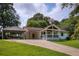 Charming single-story home with a welcoming front porch, carport, and a well-manicured lawn at 4523 Doc Sams Rd, Cumming, GA 30028