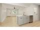 Open kitchen area with stainless appliances, quartz countertops and seamlessly flowing into the dining area at 4523 Doc Sams Rd, Cumming, GA 30028