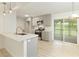 Updated kitchen with quartz countertops, grey cabinets, stainless steel appliances and open to eating area at 4523 Doc Sams Rd, Cumming, GA 30028