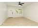 Bright living room with new flooring, a ceiling fan, and a door to the porch at 4523 Doc Sams Rd, Cumming, GA 30028