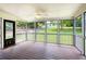 Relaxing screened porch with wood floors and a ceiling fan at 4523 Doc Sams Rd, Cumming, GA 30028