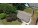 Aerial view showcases the home's layout, including mature trees, roof, and outdoor space at 1150 Terramont Dr, Roswell, GA 30076
