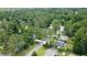 Aerial view of a neighborhood surrounded by mature trees and lush greenery at 1150 Terramont Dr, Roswell, GA 30076