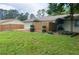 Nice backyard featuring a lawn, partial fence and some mature trees at 1150 Terramont Dr, Roswell, GA 30076