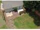 Aerial view of the backyard featuring a patio, mature trees, and a fenced perimeter at 1150 Terramont Dr, Roswell, GA 30076