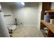Unfinished basement with water heater, paint supplies, and storage shelving at 1150 Terramont Dr, Roswell, GA 30076