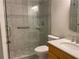 Updated bathroom featuring tiled shower with glass doors, sink and granite vanity at 1150 Terramont Dr, Roswell, GA 30076