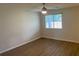 Comfortable bedroom featuring wood-look flooring, a ceiling fan, and natural light at 1150 Terramont Dr, Roswell, GA 30076