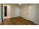 Bedroom with hardwood floors, ceiling fan, closet and view to en-suite bathroom at 1150 Terramont Dr, Roswell, GA 30076
