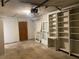 Spacious garage with shelving and a door, offering ample storage and convenient access at 1150 Terramont Dr, Roswell, GA 30076