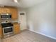 Kitchen features stainless steel appliances and tile flooring at 1150 Terramont Dr, Roswell, GA 30076