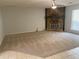 Spacious living room with a stone fireplace, ceiling fan, and carpet flooring at 1150 Terramont Dr, Roswell, GA 30076