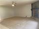 Bright living room featuring a stone fireplace and neutral carpeting at 1150 Terramont Dr, Roswell, GA 30076