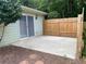 A private outdoor patio area with a wooden fence, perfect for relaxing or entertaining at 1150 Terramont Dr, Roswell, GA 30076