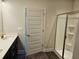 Bathroom showcasing a single vanity, quartz countertop, and a modern glass-enclosed shower at 145 Scarlett Place Dr, Bowdon, GA 30108