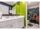 Bathroom with double sinks, stylish vanity, and unique gamer-themed shower curtain, adding personality at 36 Ivy Chase Loop, Dallas, GA 30157