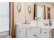 Bright bathroom featuring double sink vanity, modern fixtures, and stylish decorative sconces at 36 Ivy Chase Loop, Dallas, GA 30157