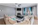 Comfortable living room featuring a fireplace, plush sofa, hardwood floors, and bright window accents at 36 Ivy Chase Loop, Dallas, GA 30157