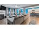 Inviting living room with an open layout, hardwood floors, a fireplace, a dining area, and a partial kitchen view at 36 Ivy Chase Loop, Dallas, GA 30157