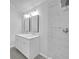 Bathroom featuring double sinks and updated walk-in shower at 63 Lakeview Ln, Stockbridge, GA 30281