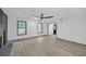 Spacious living room featuring wood flooring, fireplace, and natural light from windows at 63 Lakeview Ln, Stockbridge, GA 30281