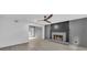 Inviting living room featuring a fireplace, wood floors, and a view into the dining room at 63 Lakeview Ln, Stockbridge, GA 30281
