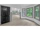 Bright sun room with multiple windows, a skylight, wood floors, and gray trim at 63 Lakeview Ln, Stockbridge, GA 30281