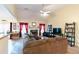 Comfortable living room featuring neutral tones, a fireplace, and ample natural light at 9444 Lakeview Ct, Douglasville, GA 30135