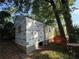 The framed home is being built in a wooded lot, showing framing, siding, and the foundation at 1106 Donnelly Sw Ave, Atlanta, GA 30310