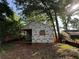 The framed home is being built in a wooded lot, showing framing and building supplies at 1106 Donnelly Sw Ave, Atlanta, GA 30310