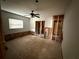 A bedroom ready for renovation, featuring a window, partial wall board and original hardwood floors needing refinishing at 1106 Donnelly Sw Ave, Atlanta, GA 30310