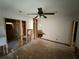 Living room mid renovation showcasing exposed walls and original hardwood floors needing refinishing at 1106 Donnelly Sw Ave, Atlanta, GA 30310