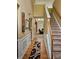 Inviting entryway with hardwood floors, elegant wainscoting, and a staircase leading to the upper level at 1697 Preserve Park Dr, Loganville, GA 30052