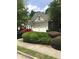 Two-car garage providing ample parking space, complemented by lush greenery and a neatly maintained lawn at 1697 Preserve Park Dr, Loganville, GA 30052