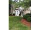 Charming home boasts a well-manicured lawn and neatly trimmed bushes, creating a welcoming curb appeal at 1697 Preserve Park Dr, Loganville, GA 30052