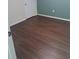 Clean bedroom featuring wood flooring, neutral paint and natural light at 1988 Greensferry Gln, Lawrenceville, GA 30043