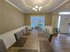 Spacious dining room with a large table, chairs, and a view of the backyard at 1988 Greensferry Gln, Lawrenceville, GA 30043