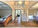 Inviting foyer with hardwood floors, high ceilings, and a staircase to the second floor at 1988 Greensferry Gln, Lawrenceville, GA 30043