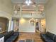 Spacious living room with high ceilings, hardwood floors, and comfortable seating at 1988 Greensferry Gln, Lawrenceville, GA 30043
