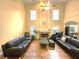 Bright living room with high ceilings, a fireplace, and two large sofas at 1988 Greensferry Gln, Lawrenceville, GA 30043